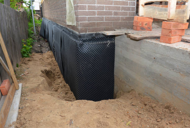 Happy homeowners after waterproofing job in Folcroft